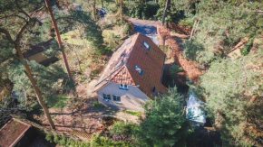 Wellnesshuis met jacuzzi en sauna in het bos